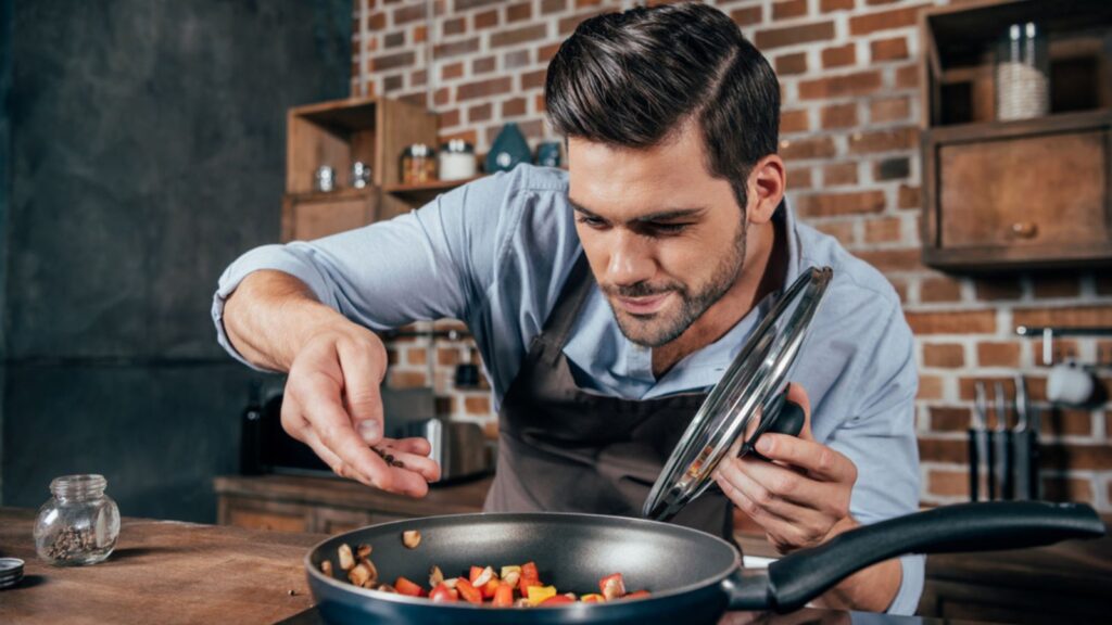 young man cooking chef kitchen meal