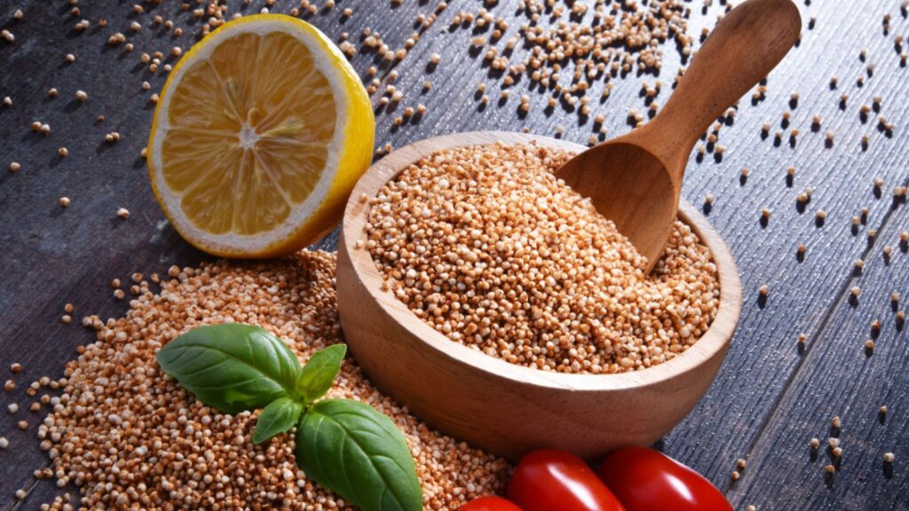 Bowl of amaranth grain on wooden table