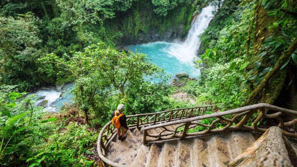 Majestic waterfall in the rainforest jungle of Costa Rica. Tropical hike