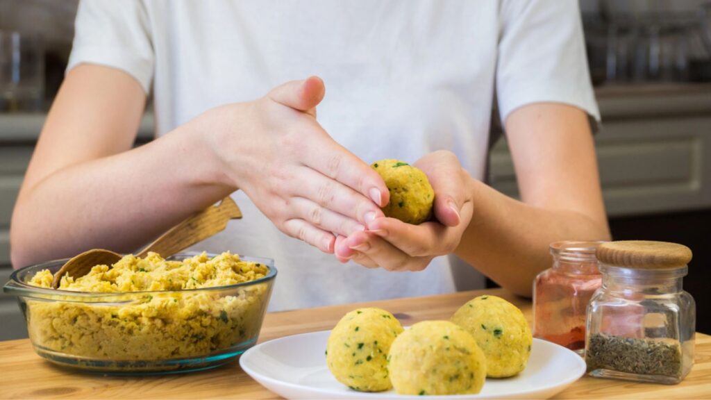 Making falafel balls out of minced chick-peas