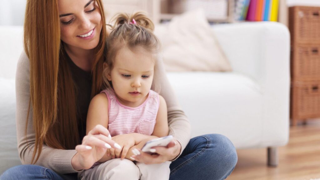 Mother and daughter using phone