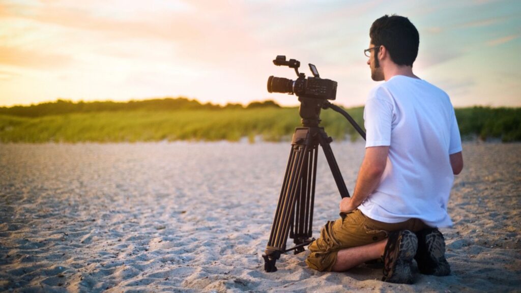 Nature Videography, A Videographer documenting a sunset on the beach