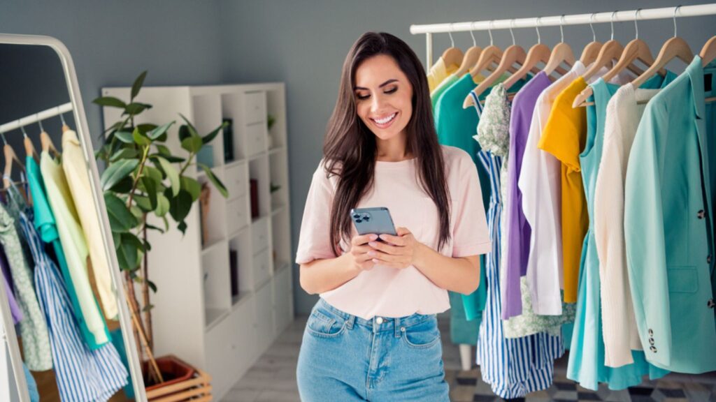 Photo of charming sweet young lady dressed pink t-shirt online shopping bargains modern device indoors house room