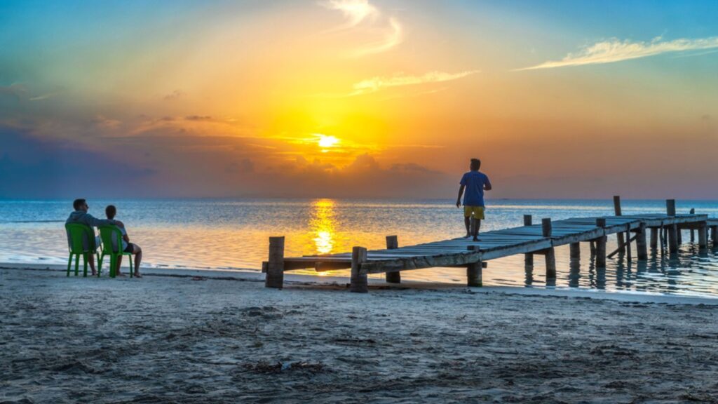 SAN BLAS ISLAND, PANAMA People watching at Beautiful sunset in Caribbean San Blas island at politically autonomous Guna territory in Panama.