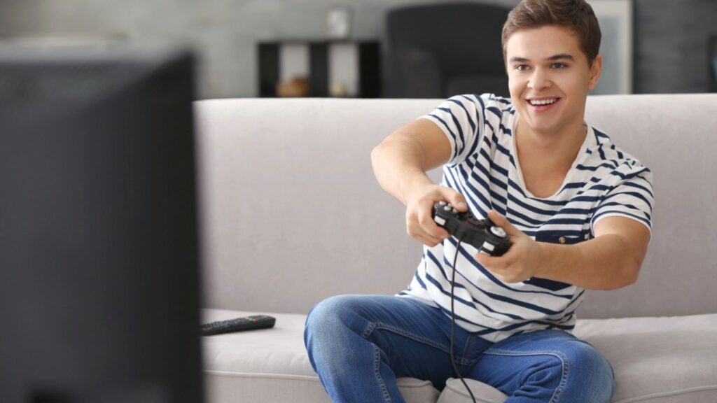 Teenager playing videogame
