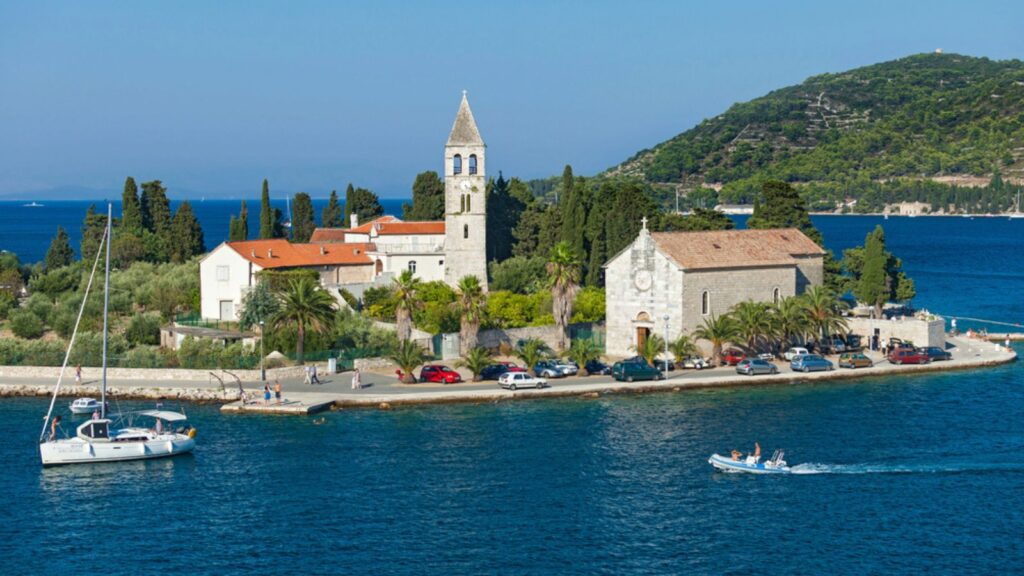 VIS, CROATIA - AUGUST 19, 2012 St. Juraj church, the first sight which greets visitors to on arrival to Vis, the furthest Croatian inhabited islan