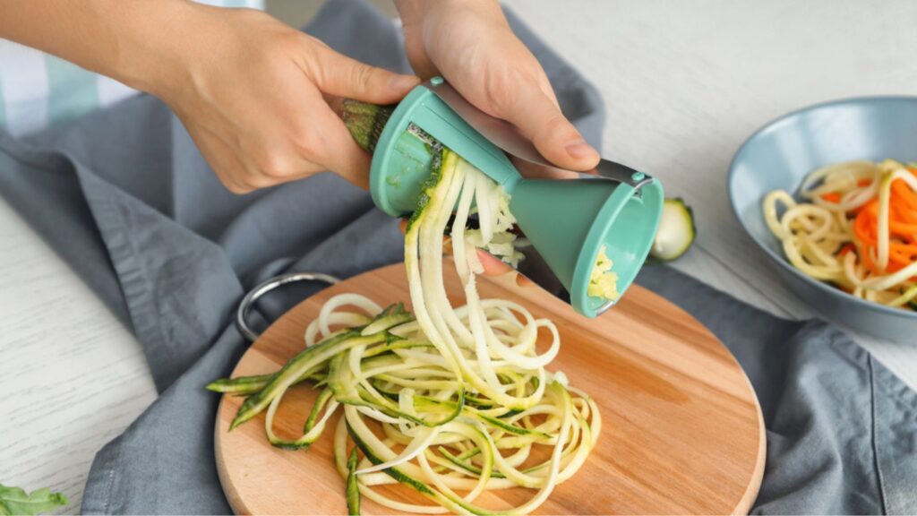 Woman making zucchini spaghetti