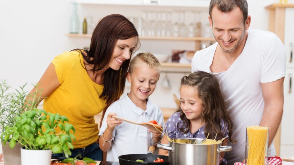 Young family cooking in the kitchen