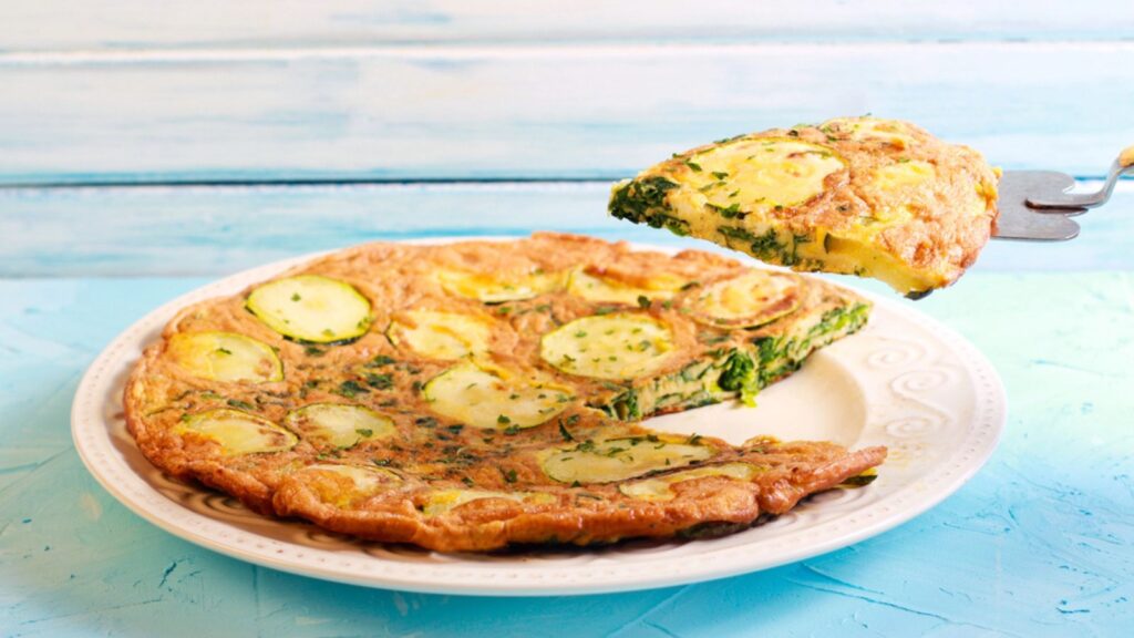 Zucchini and spinach frittata on plate