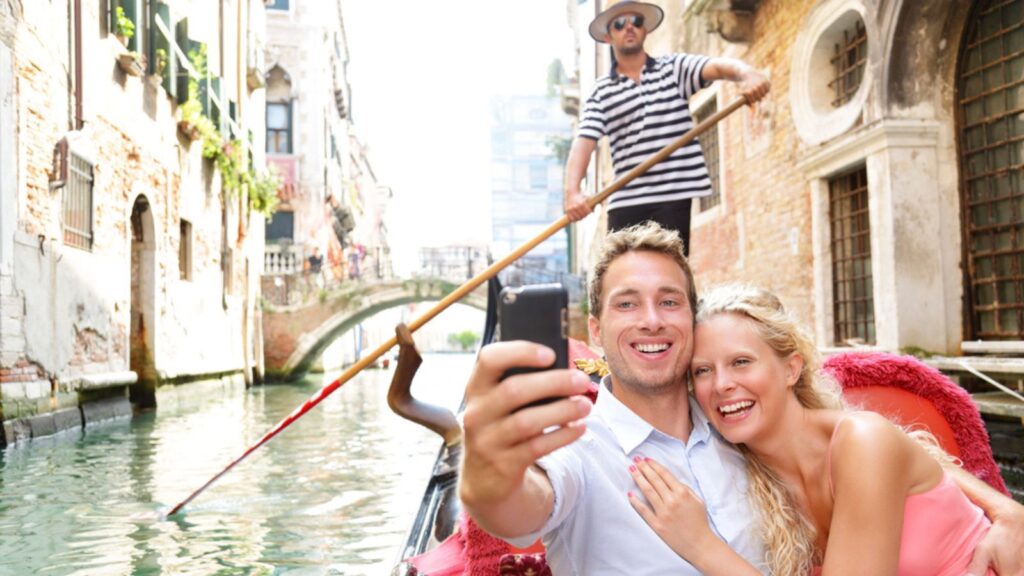 couple in venice gondola ride italy travel tourist bucket list