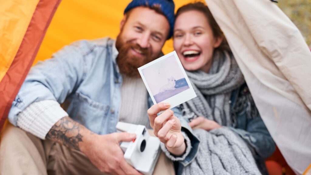 vintage camera polaroid couple camping taking picture