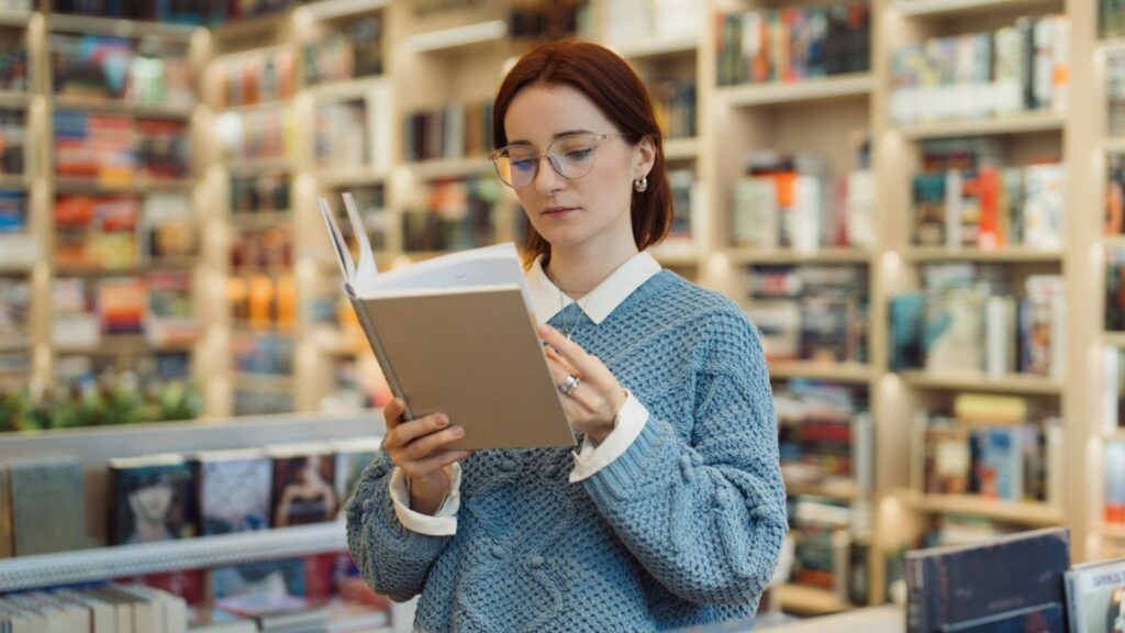 woman interested in history book library reading studying