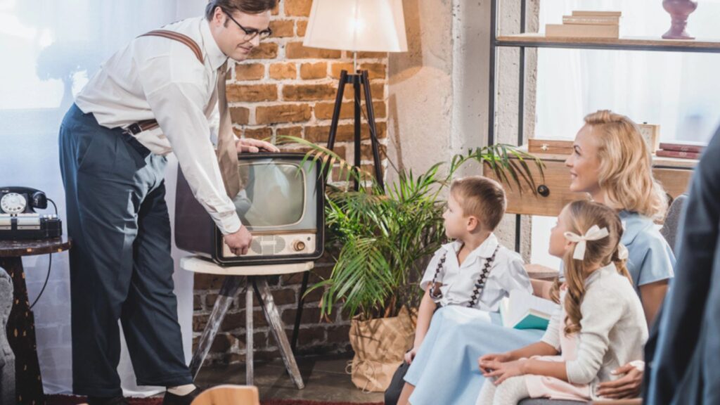 50s family watching a vintage TV family room brick