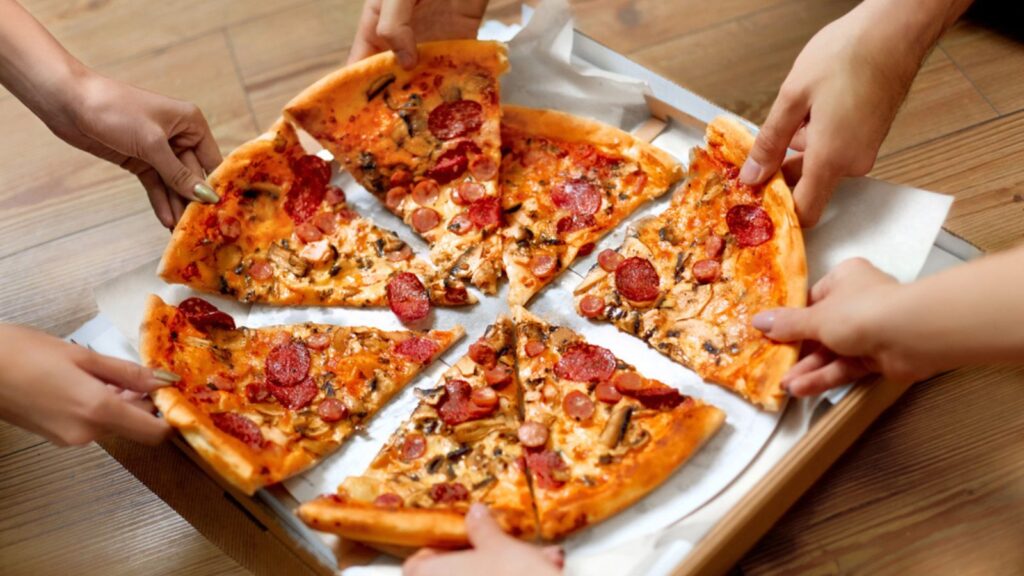 Eating Food. Close-up of People Hands Taking Slices of Pepperoni Pizza. Friends Leisure, Fast Food