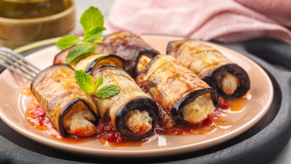 Eggplant roll ups with ricotta, parmesan cheese and tomato sauce.