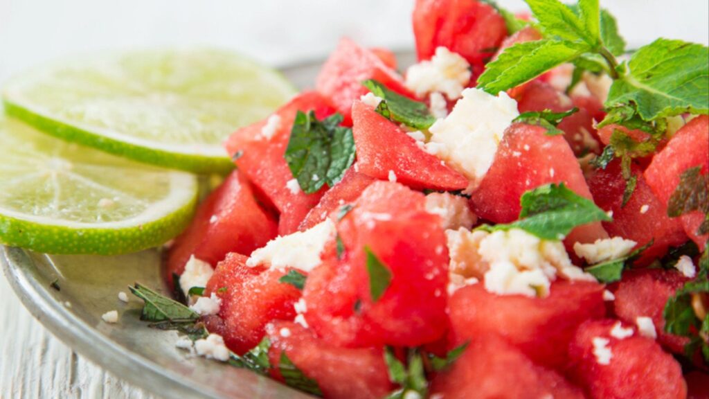 Fresh salad with water-melon, feta cheese, lime and mint