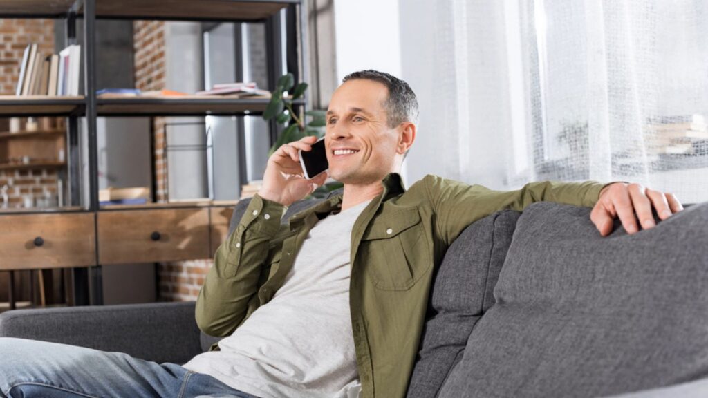 mature Man talking by phone