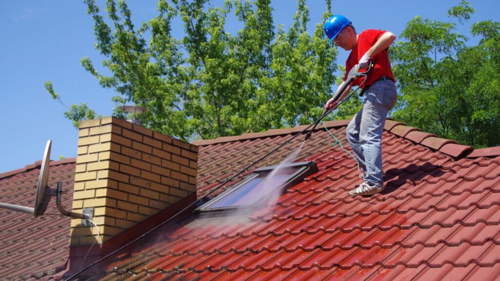 House roof cleaning with pressure tool