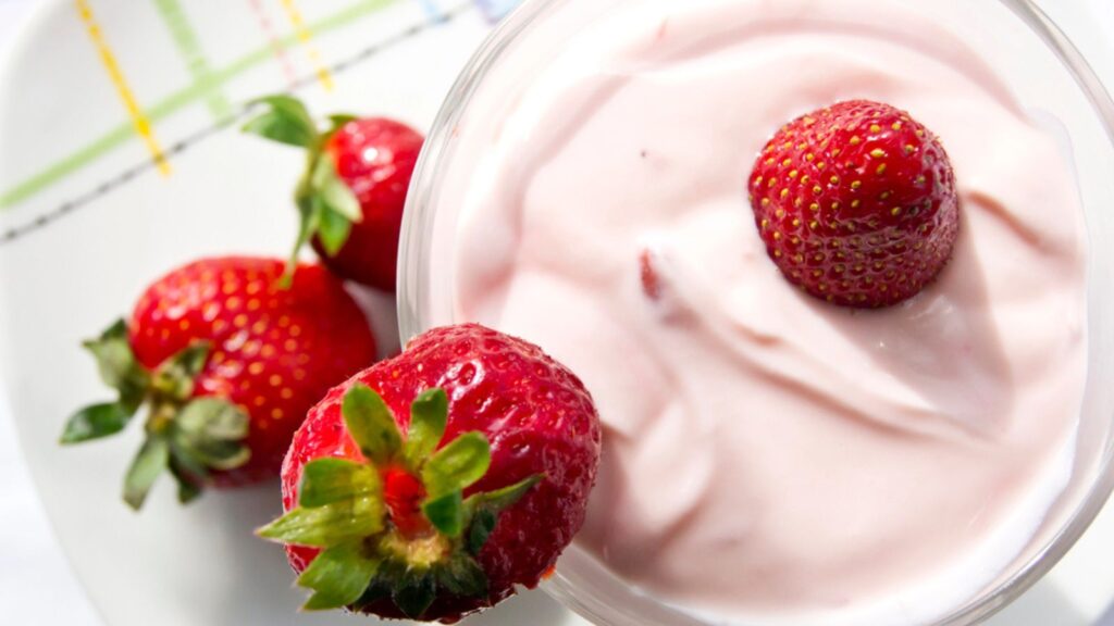 Strawberry yogurt with slices of fresh strawberries