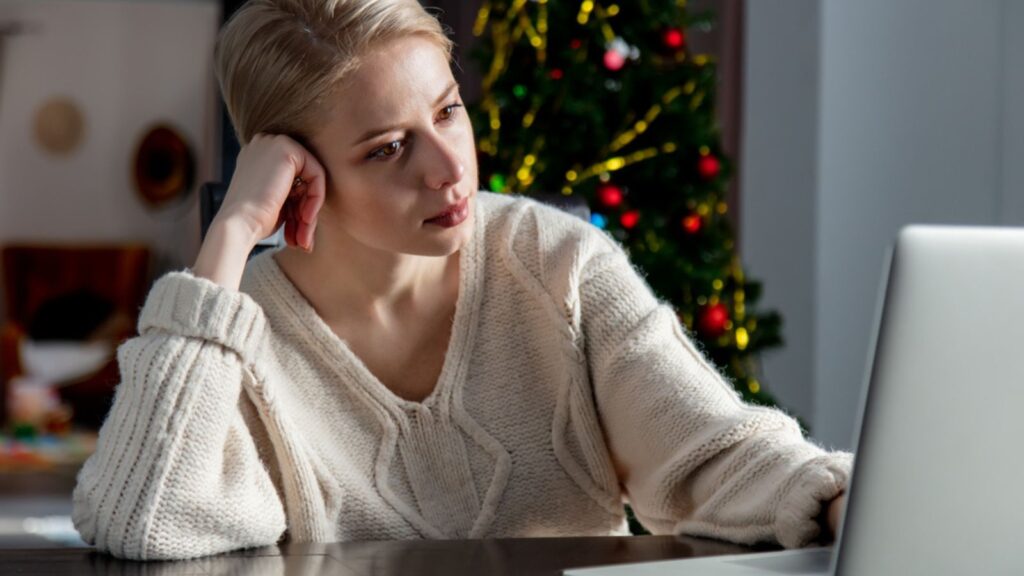depressed sad overwhelmed woman with a laptop