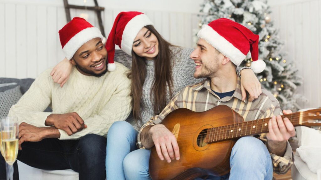 Christmas house party. Happy friends celebrating Christmas together