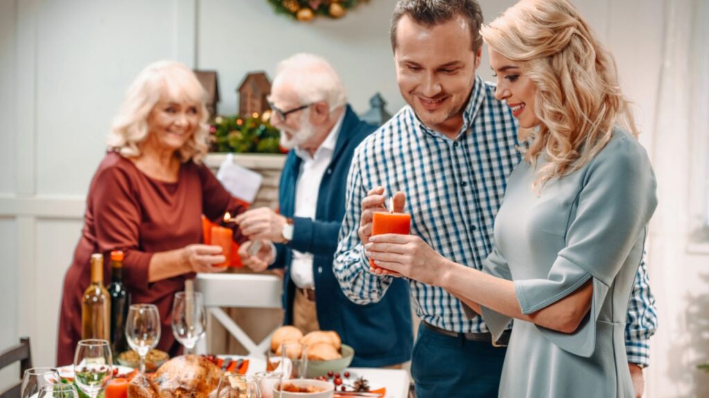 Couples helping in decorating christmas table
