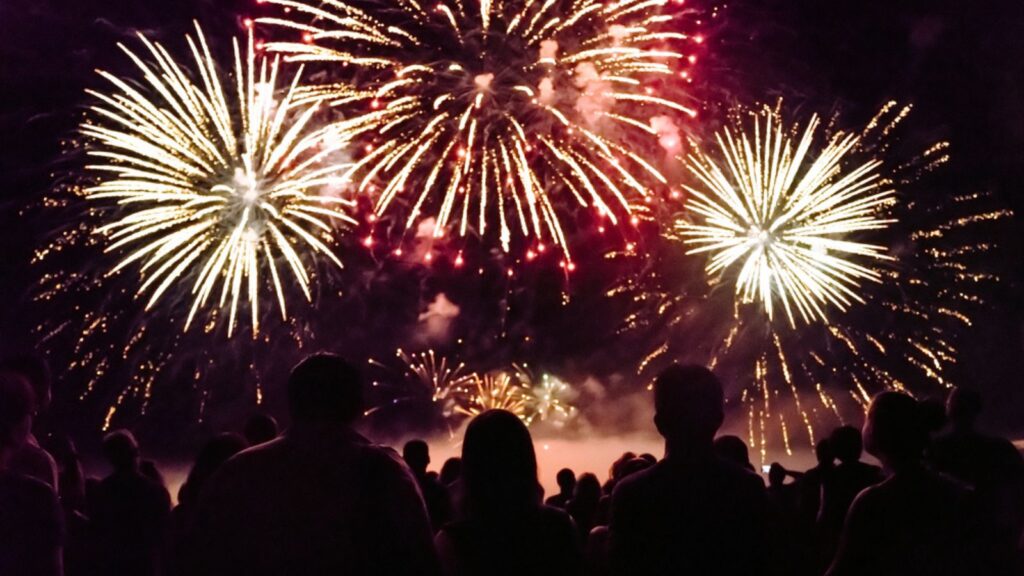 Crowd watching fireworks and celebrating new year eve