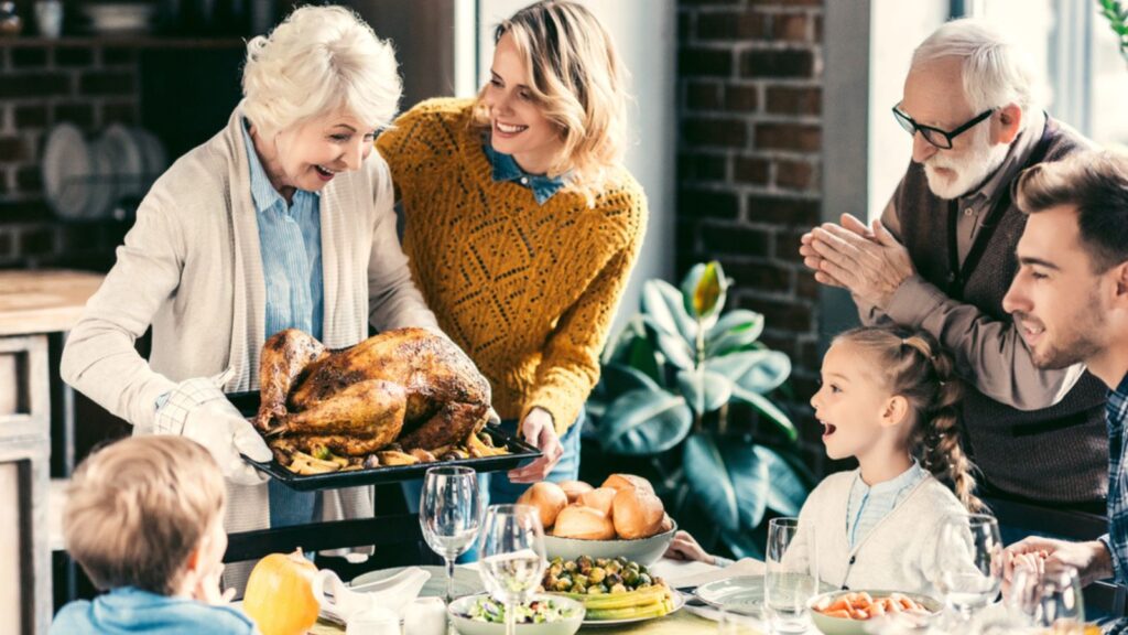 Family having holiday dinner with turkey