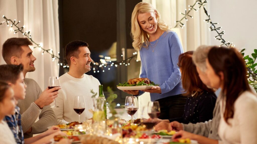 Happy family having dinner party at home
