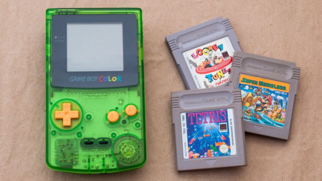 Kiev, Ukraine - June 04, 2020 Nintendo Game Boy Color 1998 with cartridges, special edition, popular handheld video game device