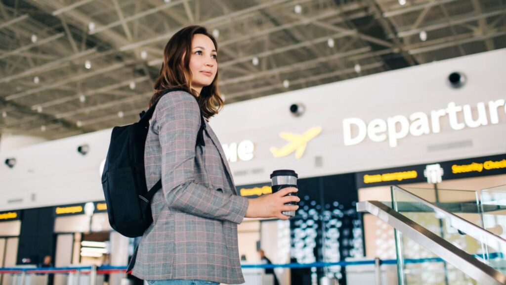 Traveler girl at the departure zone at the airport