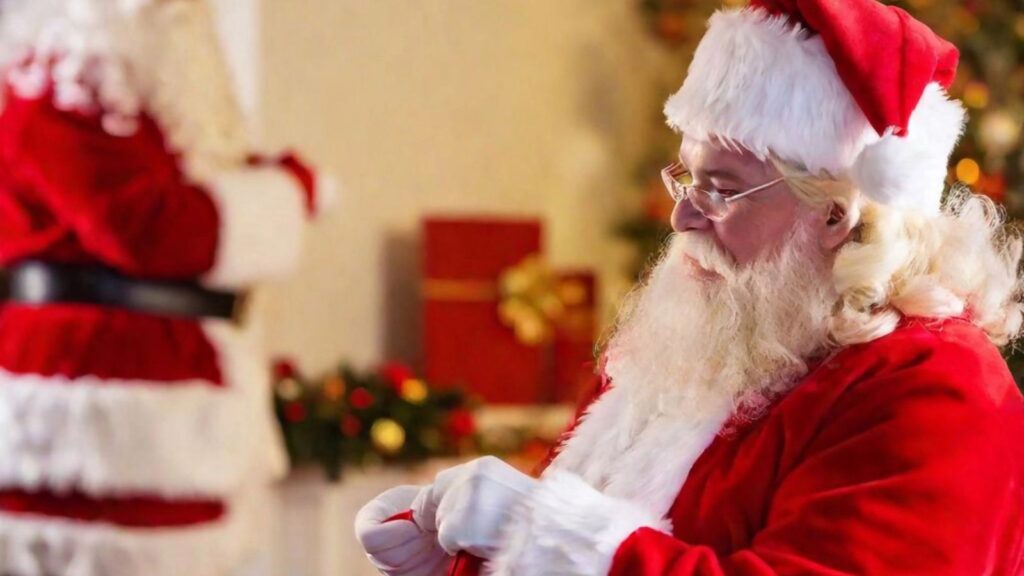 Two santa clauses at the christmas market