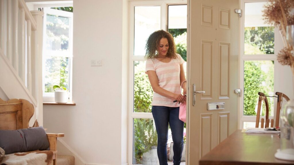 Woman Opening Front Door
