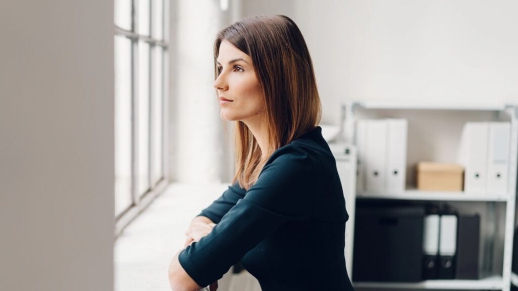 thinking Woman staring out of a window