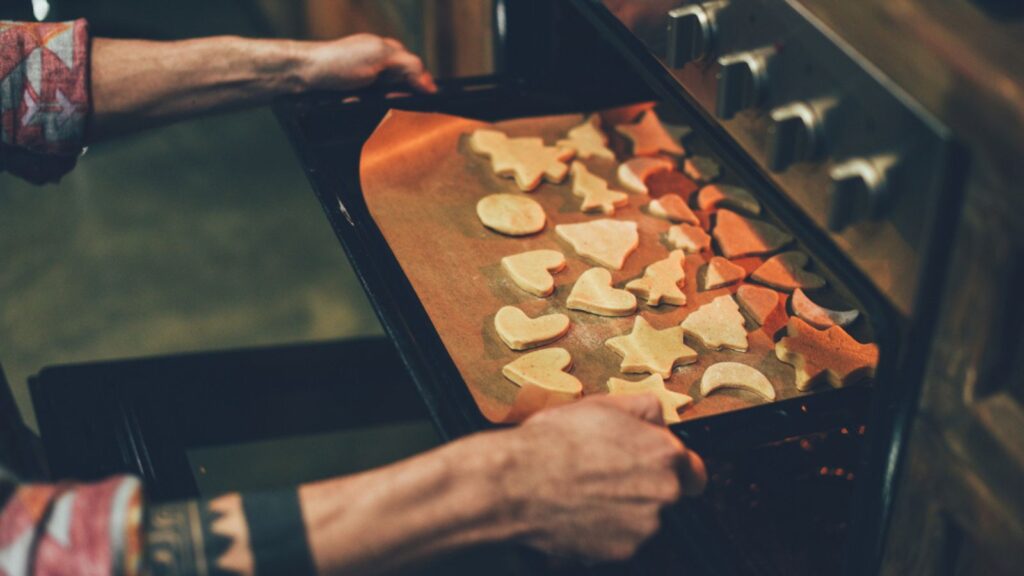 Person baking christmas cookies