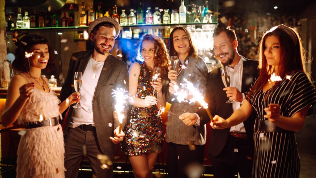 happy friends bar sparklers new years eve celebration